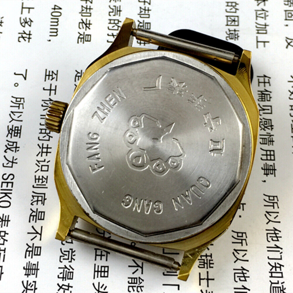 China Kongque Steel manual mechanical watch featuring 17 jewels, black dial, and gold case for a refined, elegant look.