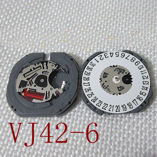 Hattori Epson TMI VJ42 watch quartz movement with date at 3 and 6, Japan made precision mechanism.