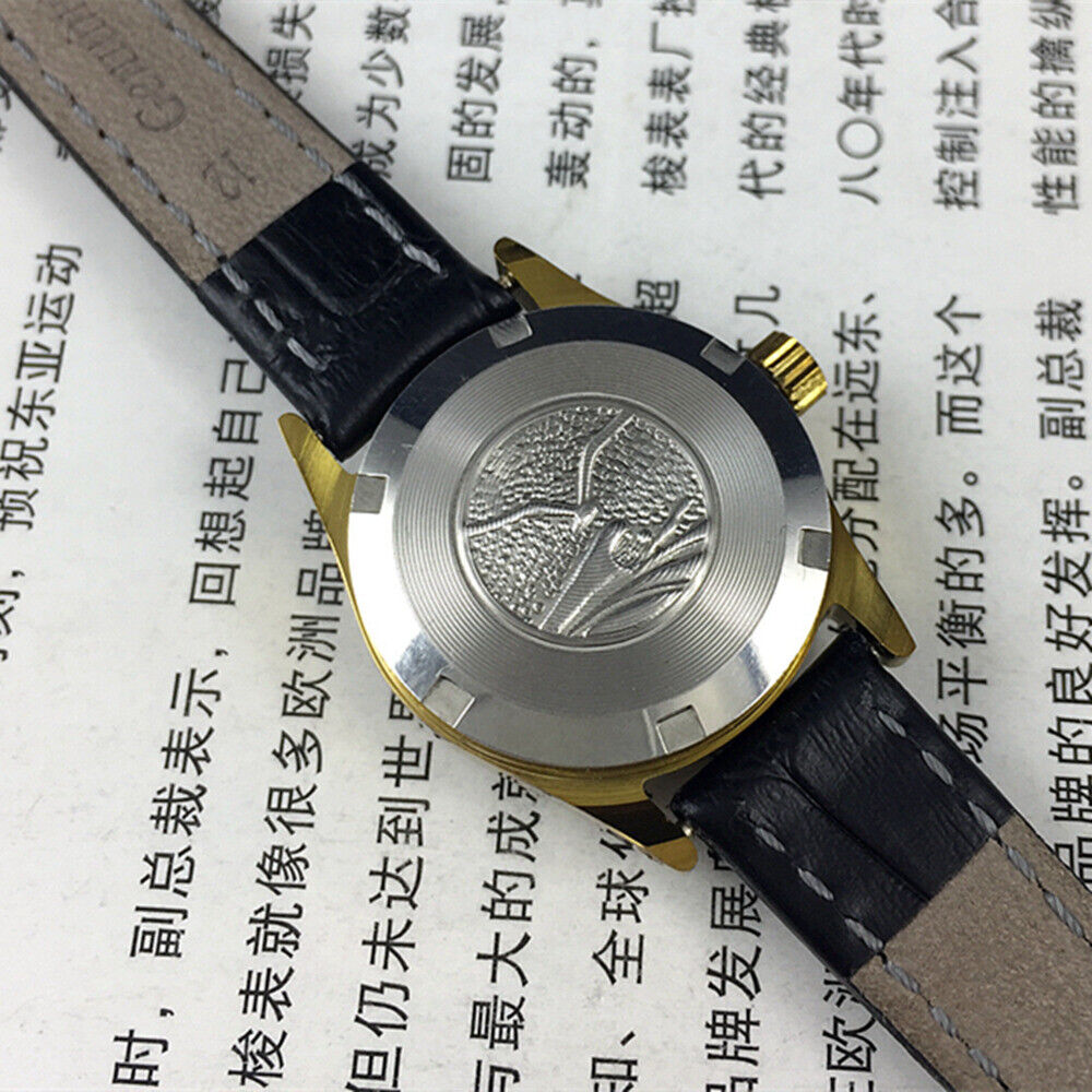 Tianjin Seagull elegant black round ladies watch with golden nail markers, manual mechanical movement, stylish accessory.