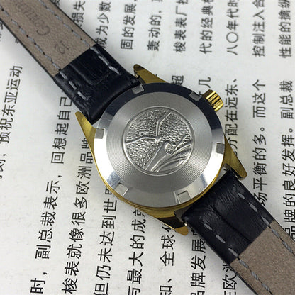 Tianjin Seagull elegant black round ladies watch with golden nail markers, manual mechanical movement, stylish accessory.