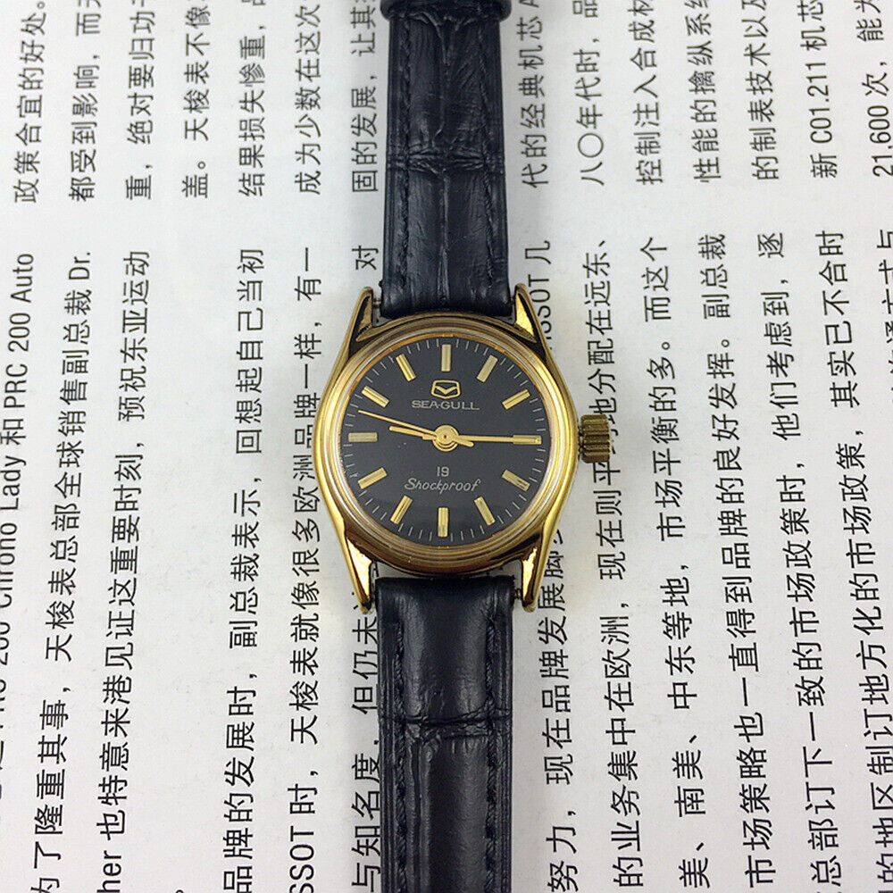 Tianjin Seagull elegant black round ladies watch with golden nail markers, manual mechanical movement, stylish accessory