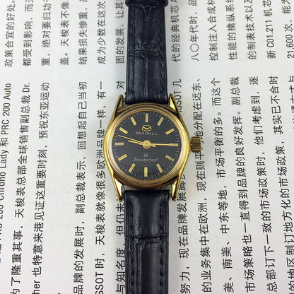 Tianjin Seagull elegant black round ladies watch with golden nail markers, manual mechanical movement, stylish accessory