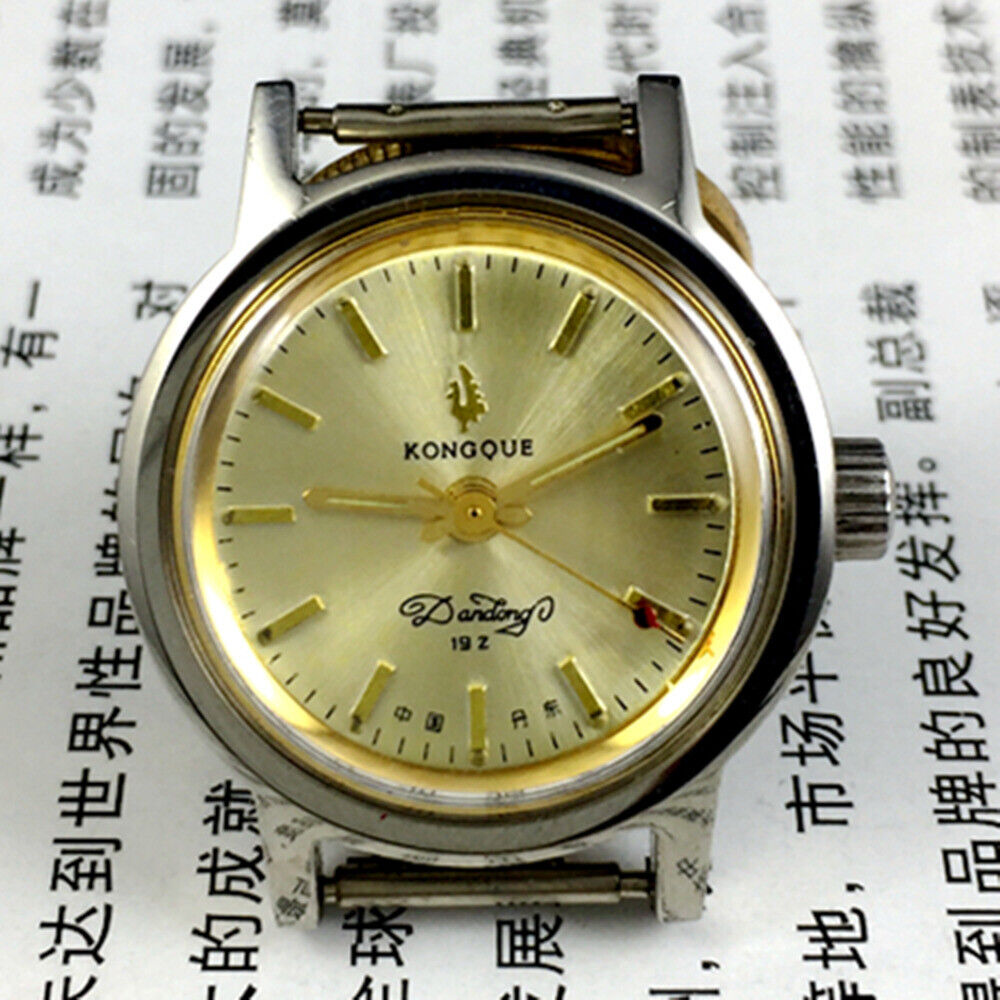 Liaoning Kongque lady mechanical watch with golden dial and 19 jewels, elegant design for daily wear.