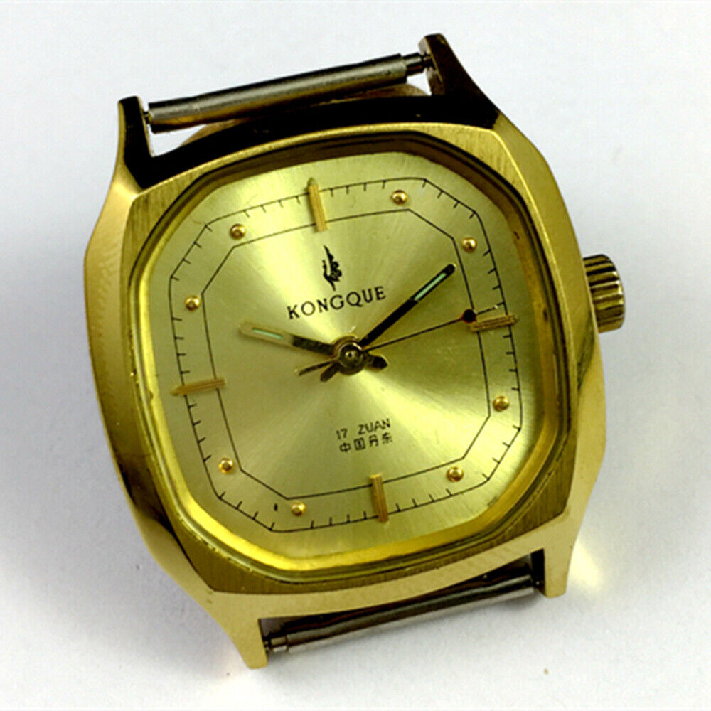 China Kongque 34mm manual steel watch with 17 jewels, golden dial, and nail markers for elegant style.