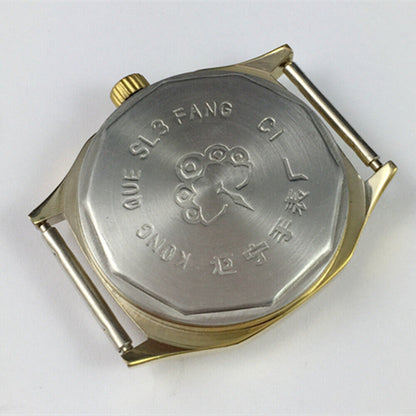 China Kongque 35mm manual mechanical watch with 17 jewels, golden dial, luminous hands for precise time reading.
