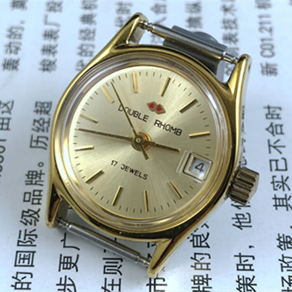 Double Rhomb golden nail lady watch with manual mechanical movement, single calendar display, and elegant case by Double Rhomb.