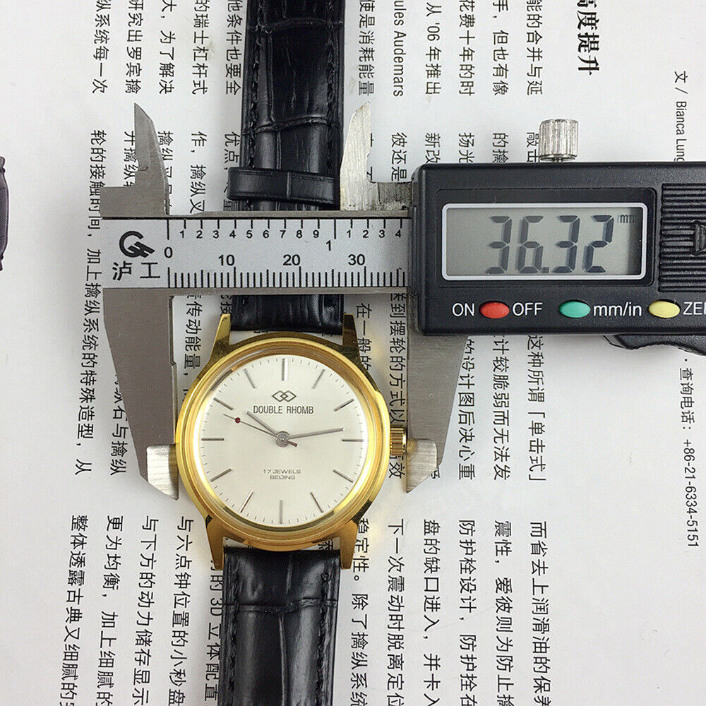 Beijing Double Rhomb mechanical watch with gold case, silver nail markers, classic style for elegant wear.