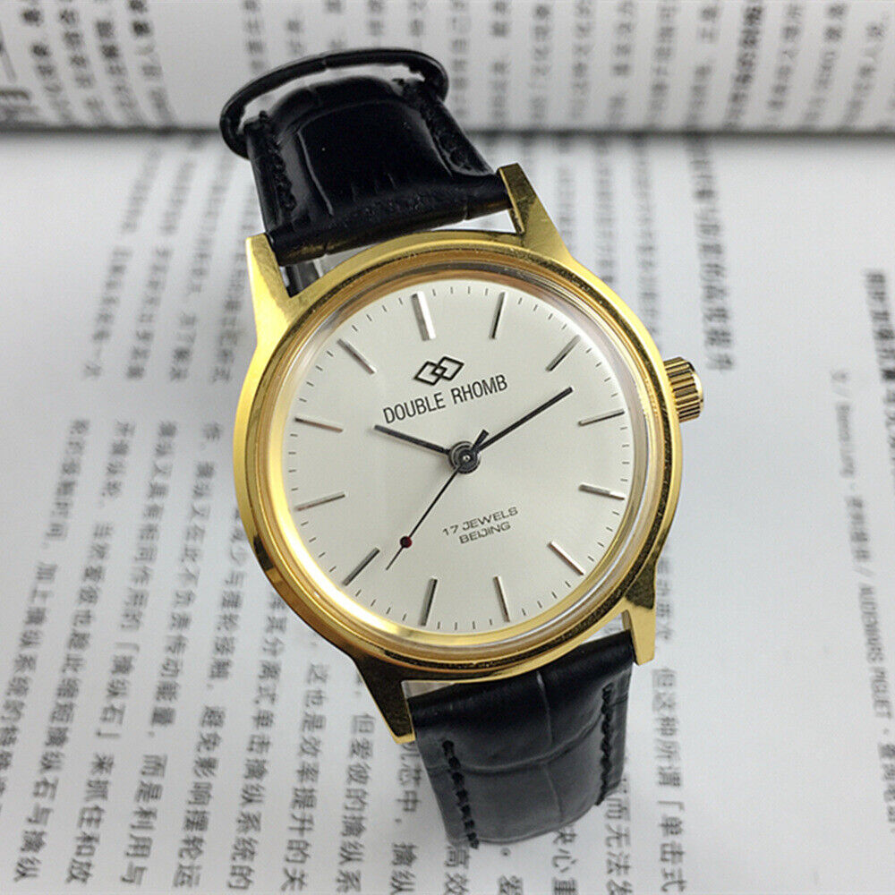 Beijing Double Rhomb manual watch with gold case, silver nail markers, classic elegance for collectors.