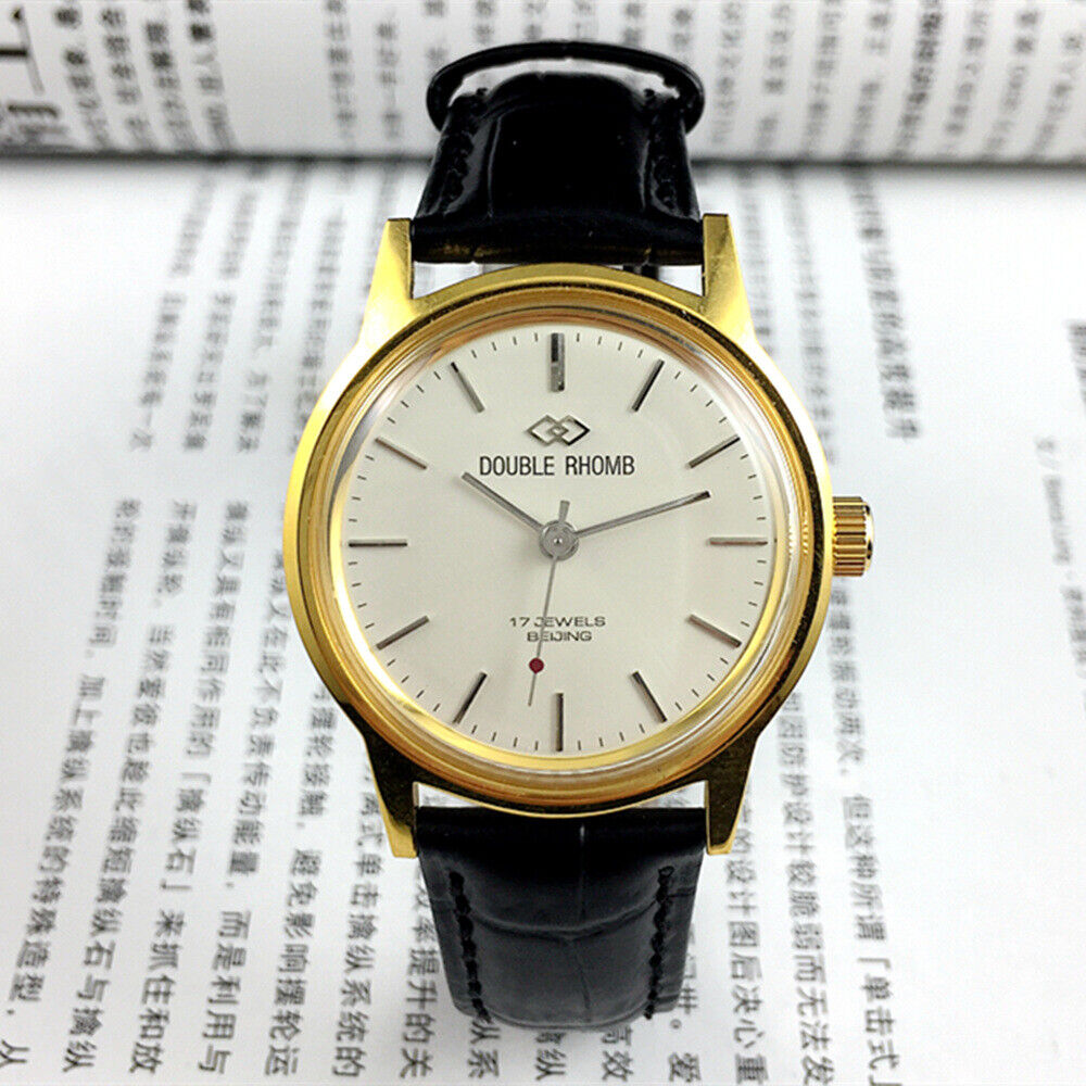 Beijing Double Rhomb manual watch with gold case and silver markers, classic style for elegant wear.