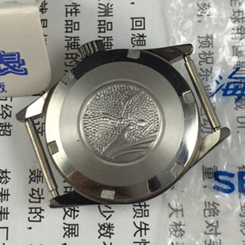 27mm Tianjin Seagull ladies watch with golden round case, black dial, and manual mechanical movement.