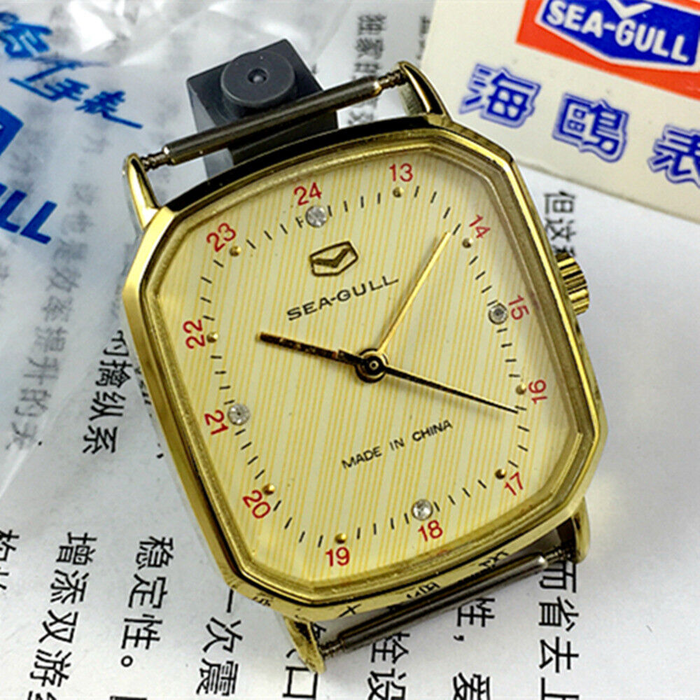 Seagull 28mm ladies watch with golden square case and manual mechanical movement, elegant design.