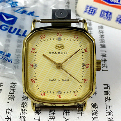 Seagull 28mm ladies watch with golden square case, manual mechanical movement, and elegant design for formal wear.