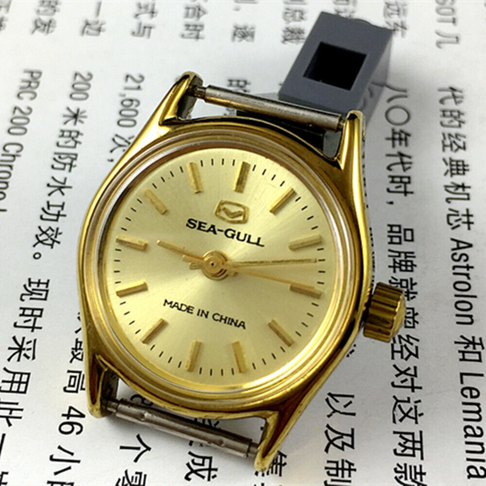 Seagull 26mm ladies watch with golden round case, manual mechanical movement, and elegant band for stylish wear.