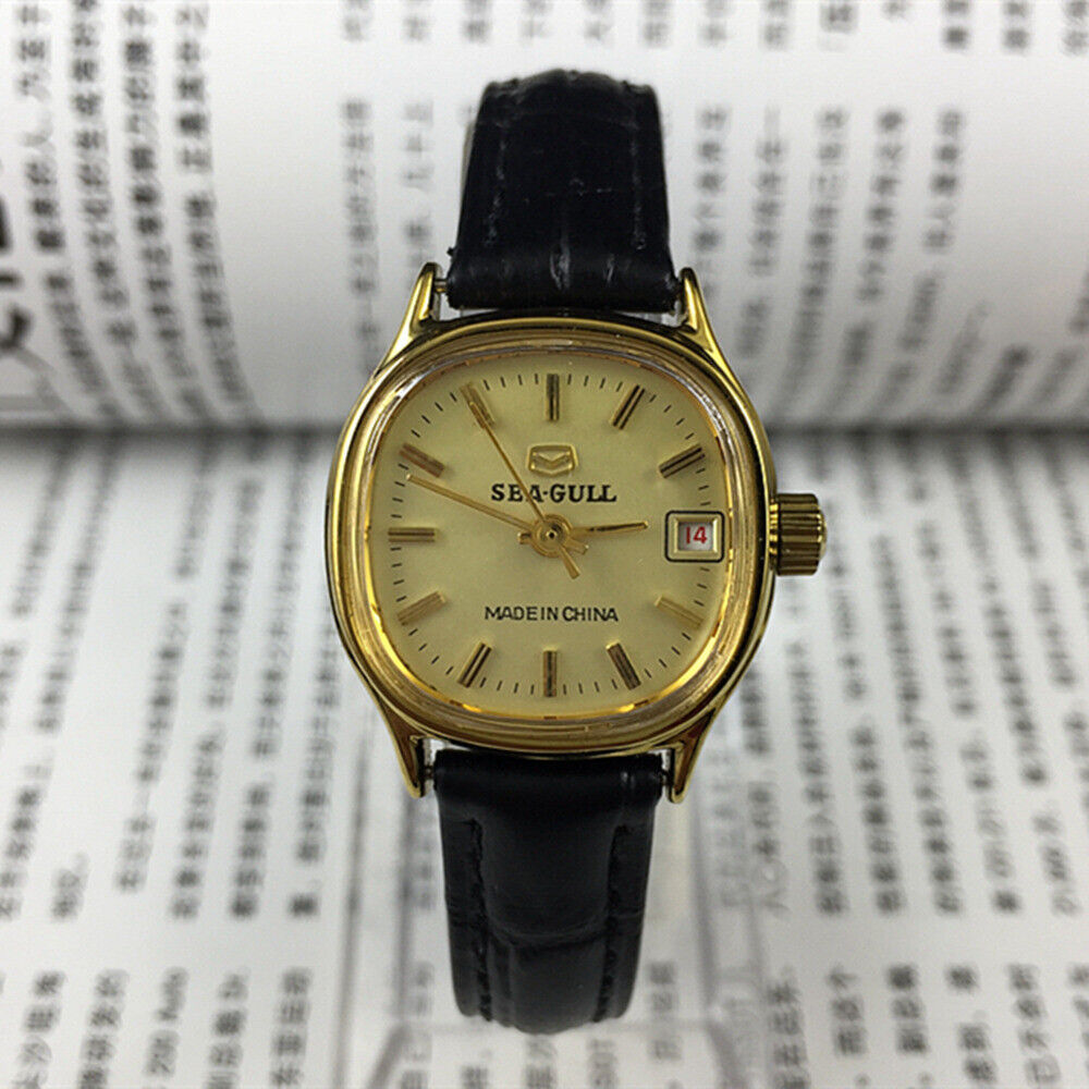 Elegant Seagull ladies watch with golden square case, nail markers, and single calendar display, manual mechanical movement.