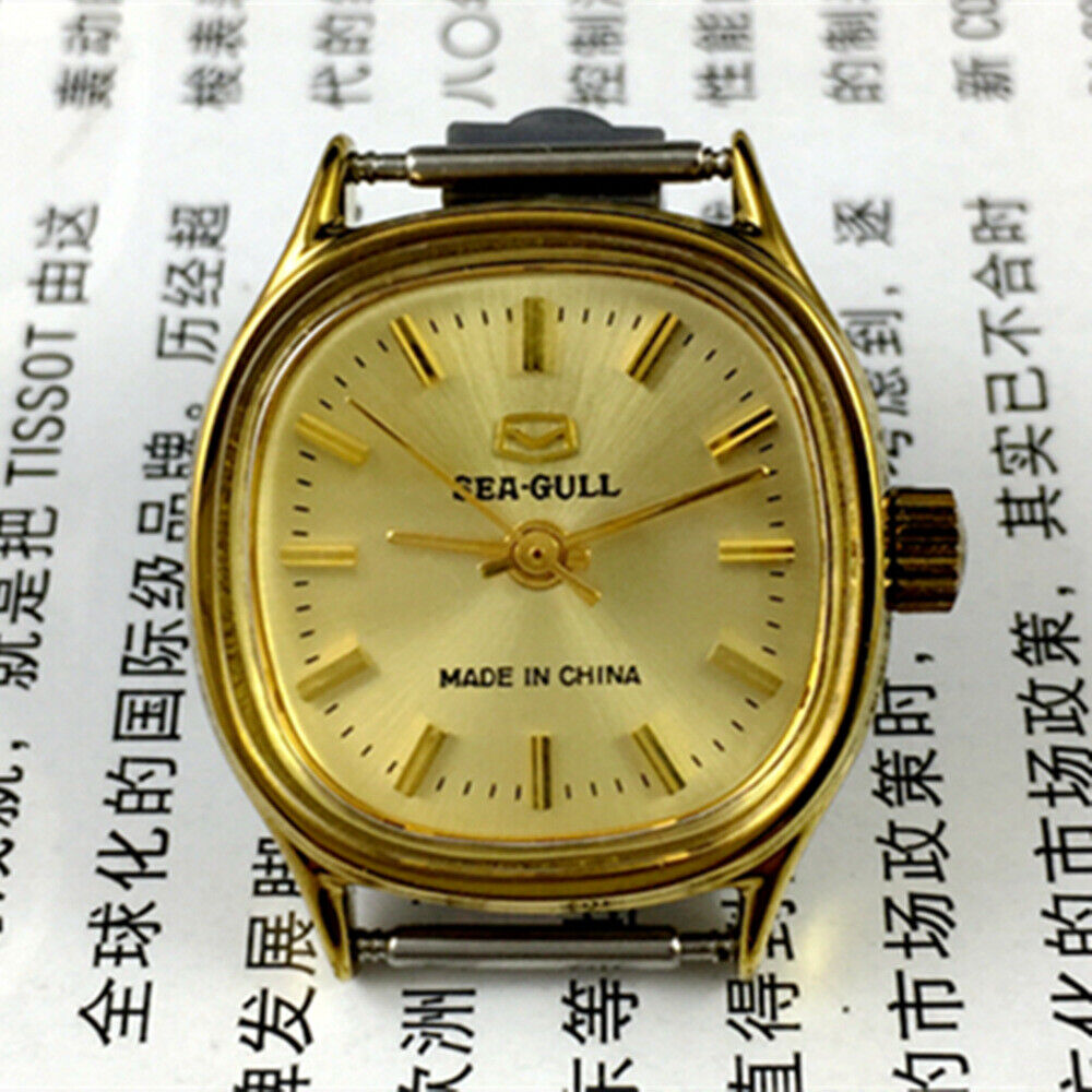 27mm square golden nail case lady watch with manual mechanical movement by Tianjin Seagull, elegant and classic design.