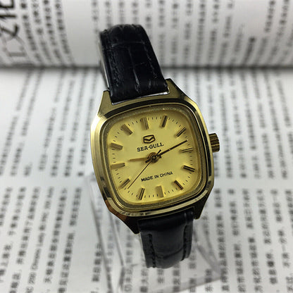 Tianjin Seagull 27mm ladies watch with golden case, mechanical movement, and elegant square dial design