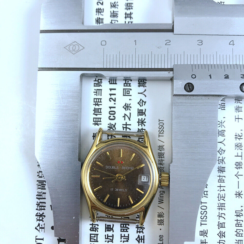 Double Rhomb lady's manual mechanical watch with golden coffee dial and single calendar, showcasing elegant design and craftsmanship.
