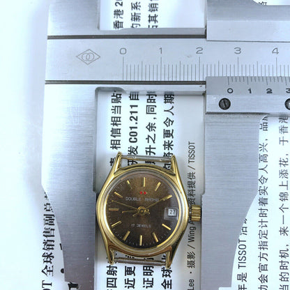 Double Rhomb lady's manual mechanical watch with golden coffee dial and single calendar, showcasing elegant design and craftsmanship.