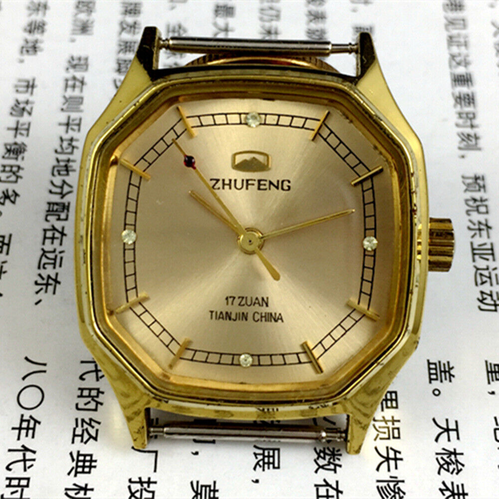 Golden octagonal 34mm Zhufeng Tianjin manual mechanical watch with intricate nail design.