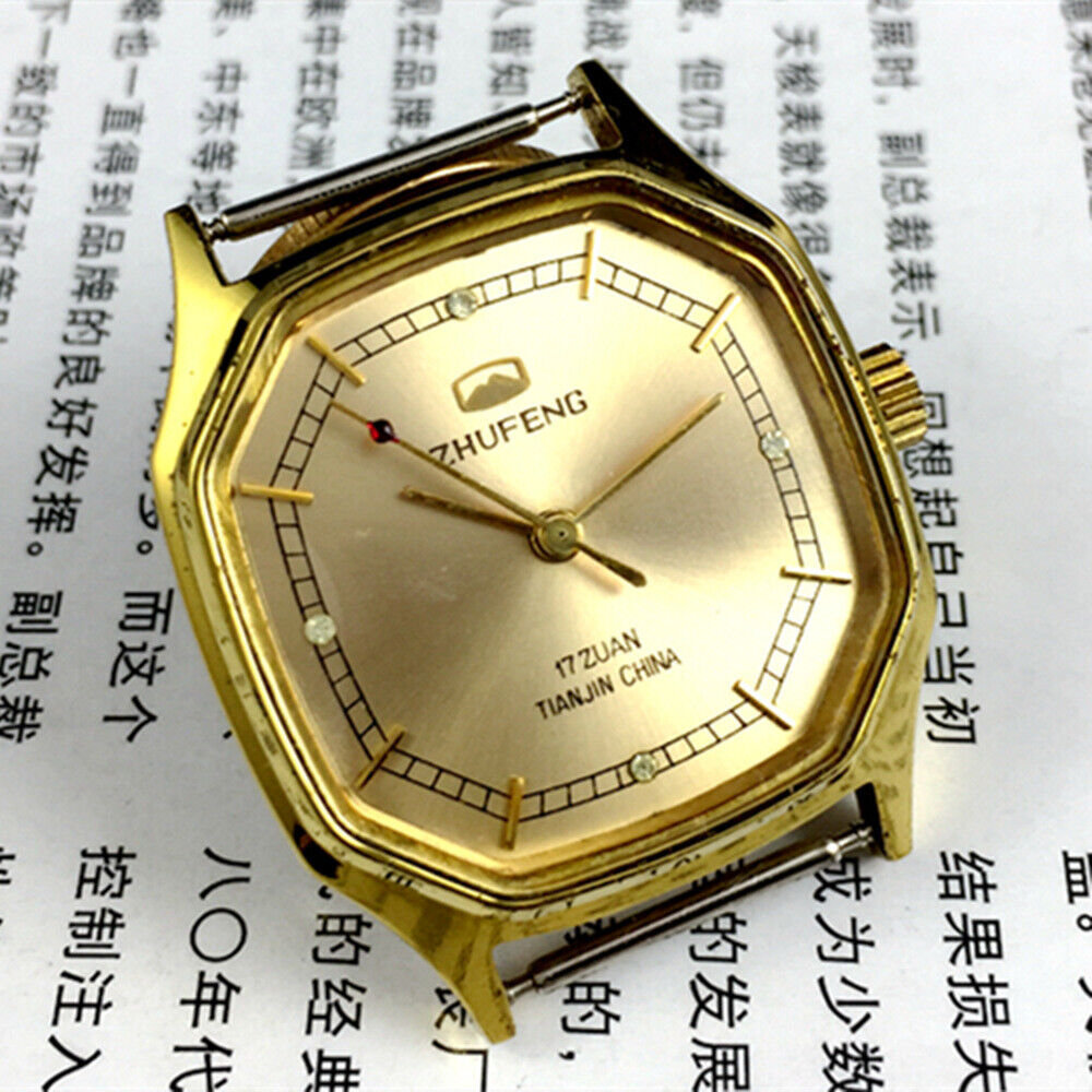 Golden octagonal 34mm Zhufeng Tianjin manual watch, detailed nail design on dial, elegant timepiece accessory.