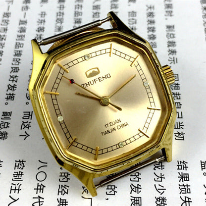 Golden octagonal 34mm Zhufeng Tianjin manual watch, detailed nail design on dial, elegant timepiece accessory.