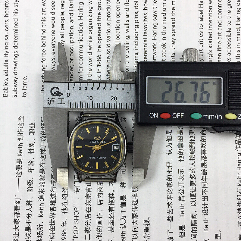 26mm Seagull manual mechanical lady watch with black case and gold markers, single calendar design.