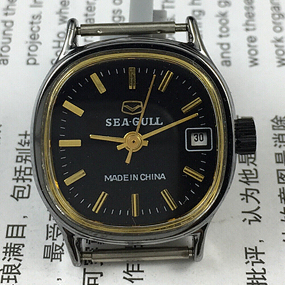 26mm Seagull lady watch with black case, golden markers, manual mechanical movement, calendar display.