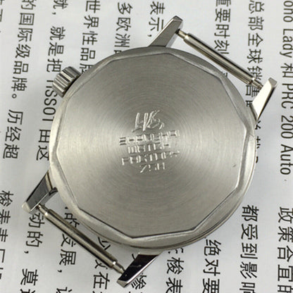 Silver 32mm Shanghai Factory manual watch with silver case, nail markers, and classic mechanical design