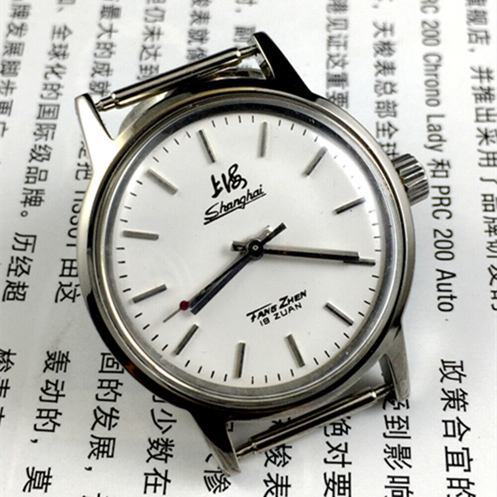 Silver 32mm Shanghai Factory manual mechanical watch with silver case, nail markers, and classic style for elegant wear.