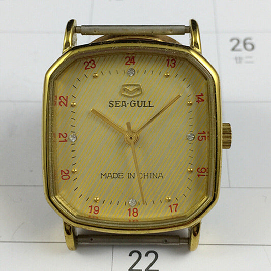 28mm golden octagonal case Tianjin Seagull watch with manual mechanical movement and elegant golden dial.