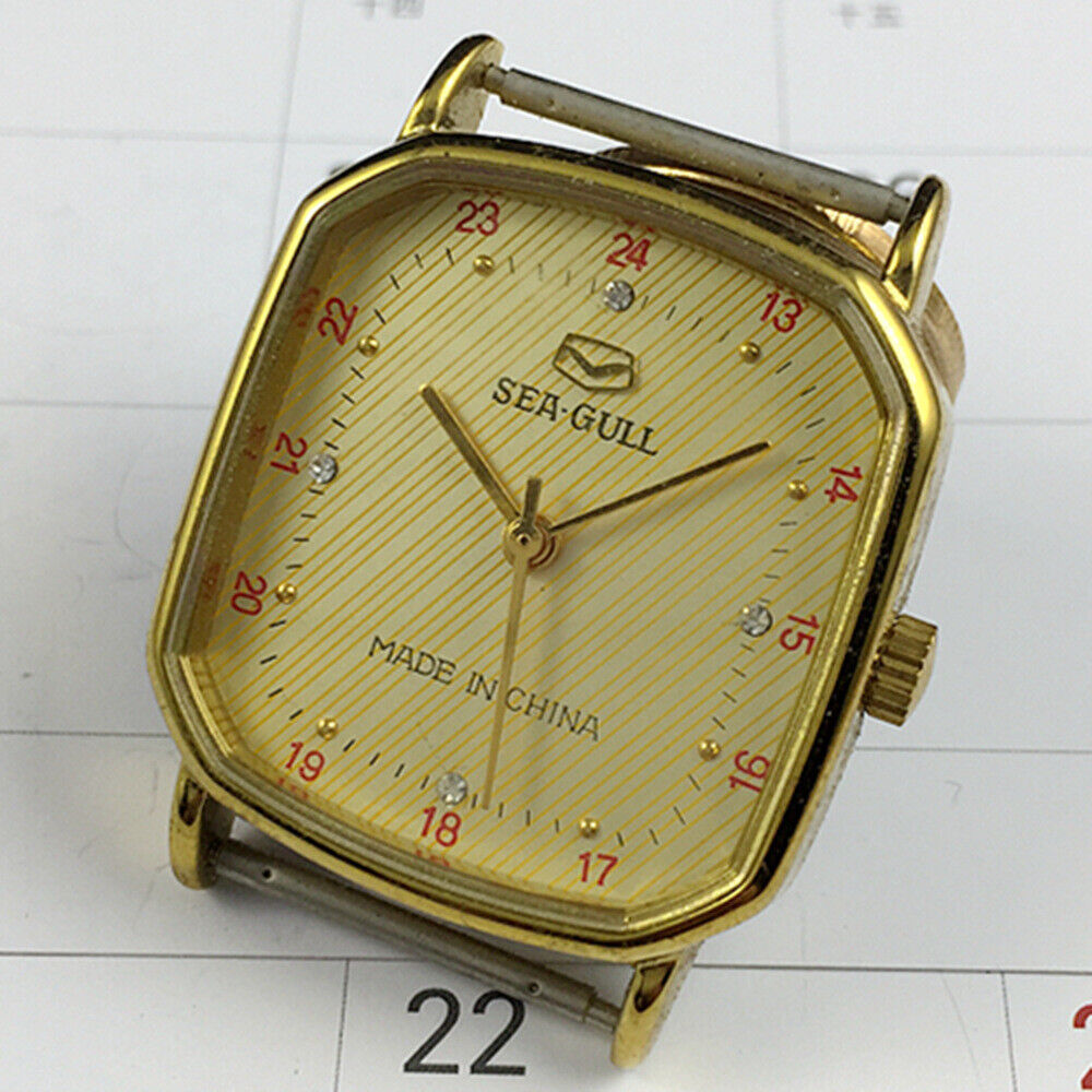 Tianjin Seagull 28mm golden octagonal watch with manual movement and elegant gold dial for stylish wear.