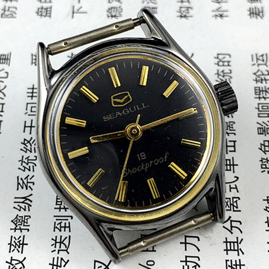 Black case Seagull ladies watch with golden hands, shock-resistant manual mechanical movement.