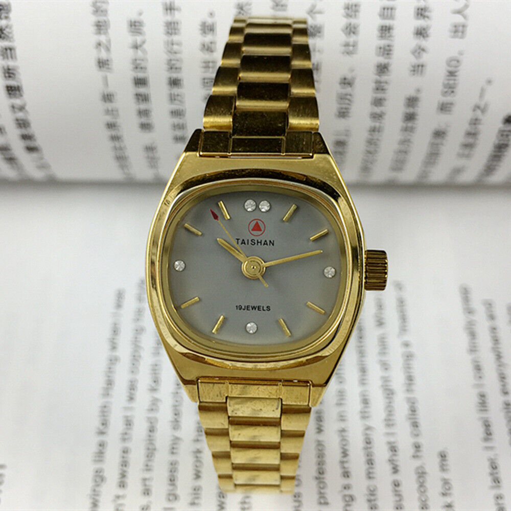 TAISHAN manual mechanical lady watch with 19 jewels, imitation diamond nails, and elegant golden case for stylish wear