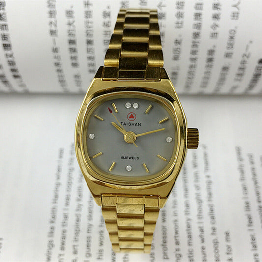 TAISHAN manual mechanical lady watch with 19 jewels, imitation diamond nails, and elegant golden case for stylish wear