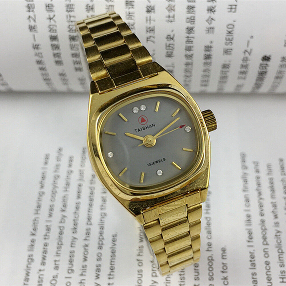 TAISHAN manual mechanical lady watch with 19 jewels, golden case, and imitation diamond nails for elegant style