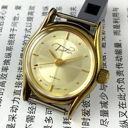 TAISHAN Lady watch with 19 jewels, champagne dial, and golden case, showcasing elegant mechanical design.