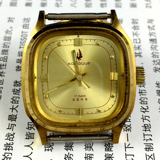Dandong 33mm manual mechanical watch with 17 jewels, golden dial, and square case in luxury style.