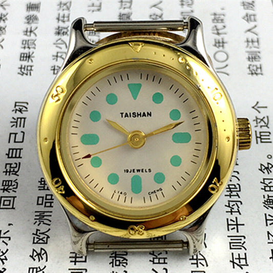 Elegant 28mm TAISHAN lady watch with golden case, numeric markers, manual mechanical movement, and 19 jewels.