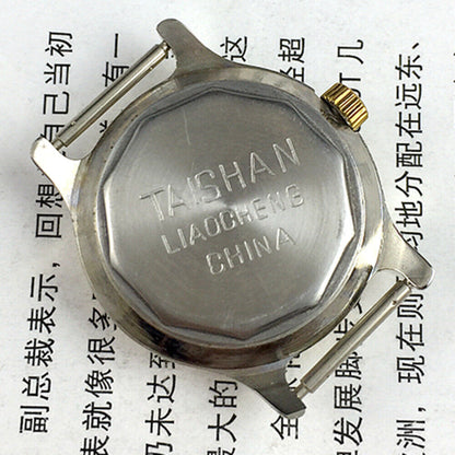 TAISHAN 28mm elegant lady watch with golden case, numeric markers, and manual mechanical movement.
