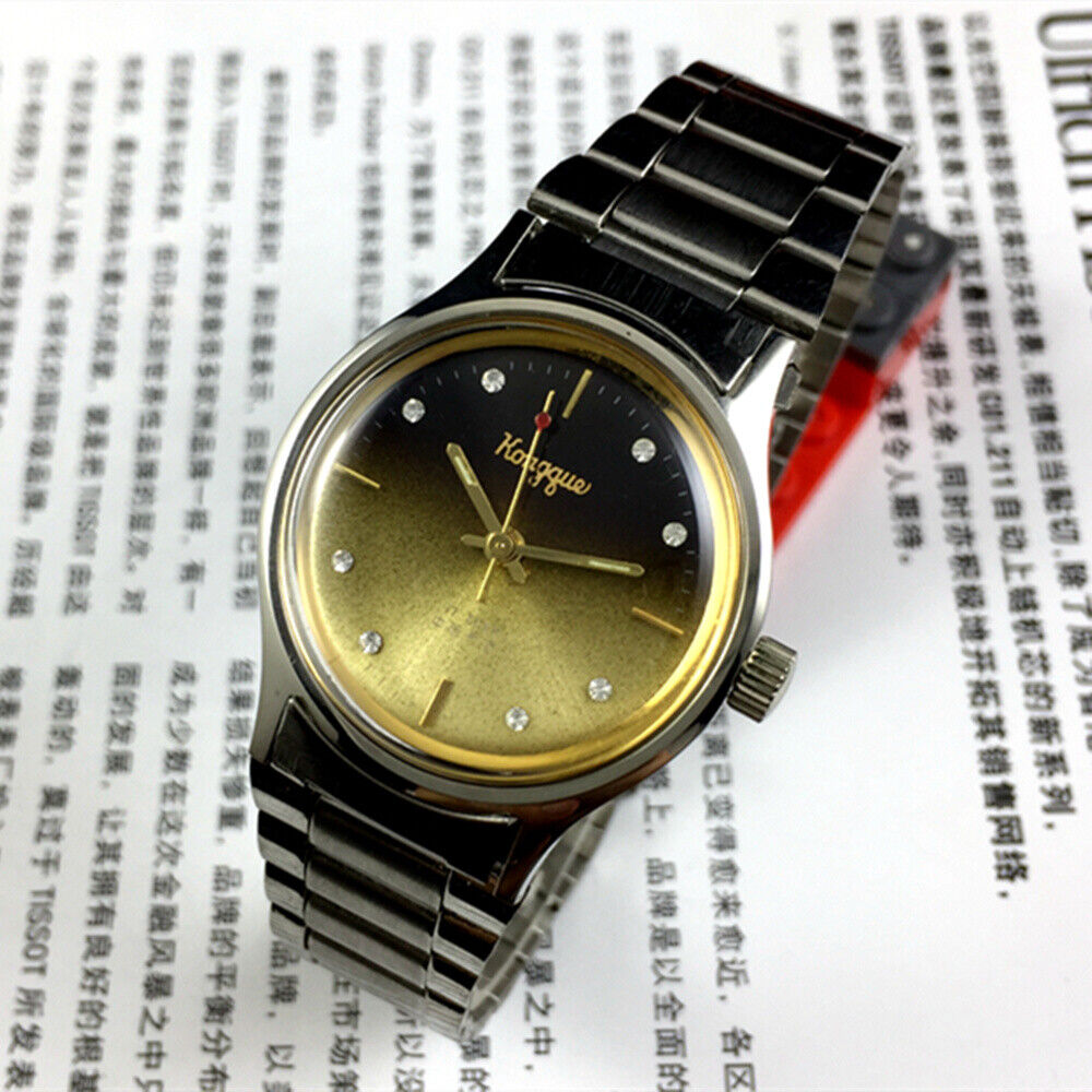 32mm Dandong manual mechanical watch with 17 jewels, gradient gold and black dial, classic design.