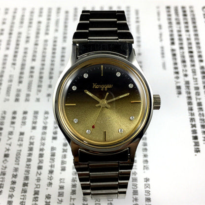 32mm Dandong manual mechanical watch with 17 jewels, gradient gold-black dial, classic style.