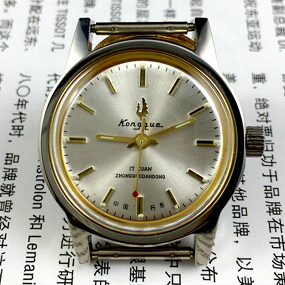 Silver dial 33mm Dandong manual mechanical watch with golden hands, 17 jewels, classic design.