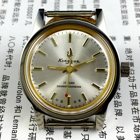 Silver dial 33mm Dandong manual mechanical watch with golden hands, 17 jewels, classic design.