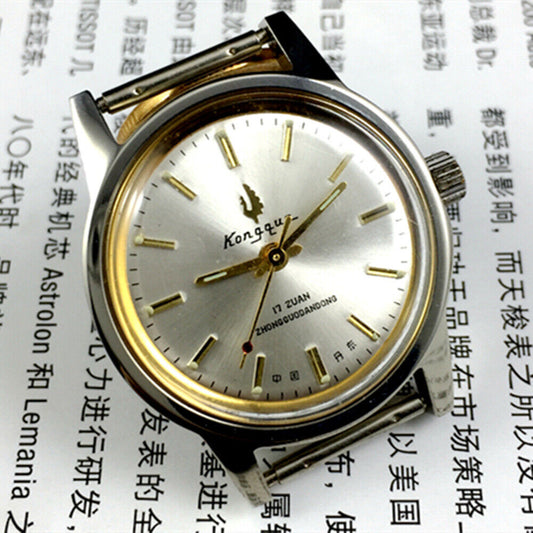 Silver dial 33mm Dandong manual mechanical watch with golden hands, 17 jewels, classic design.