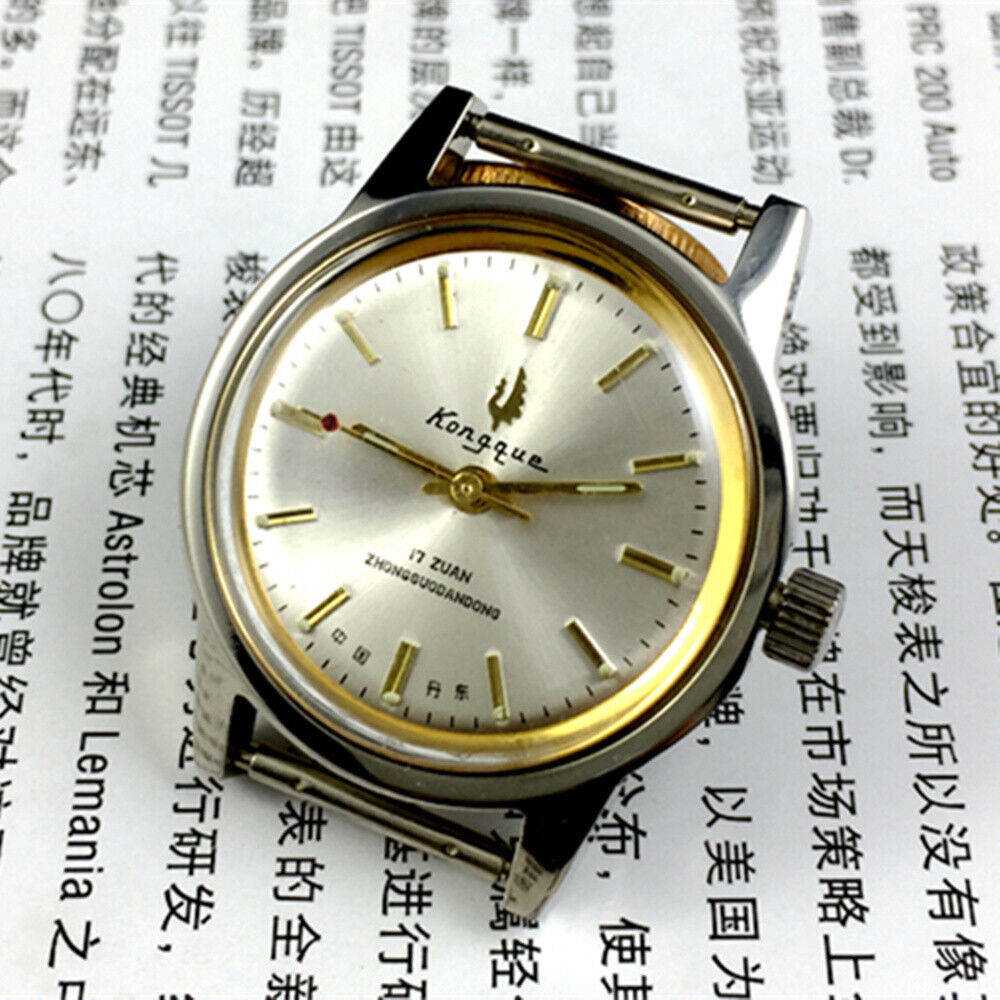 Silver dial 33mm Dandong manual watch with golden hands, 17 jewels, classic mechanical design by Dandong.