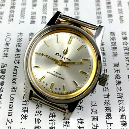 Silver dial 33mm Dandong manual watch with golden hands, 17 jewels, classic mechanical design by Dandong.