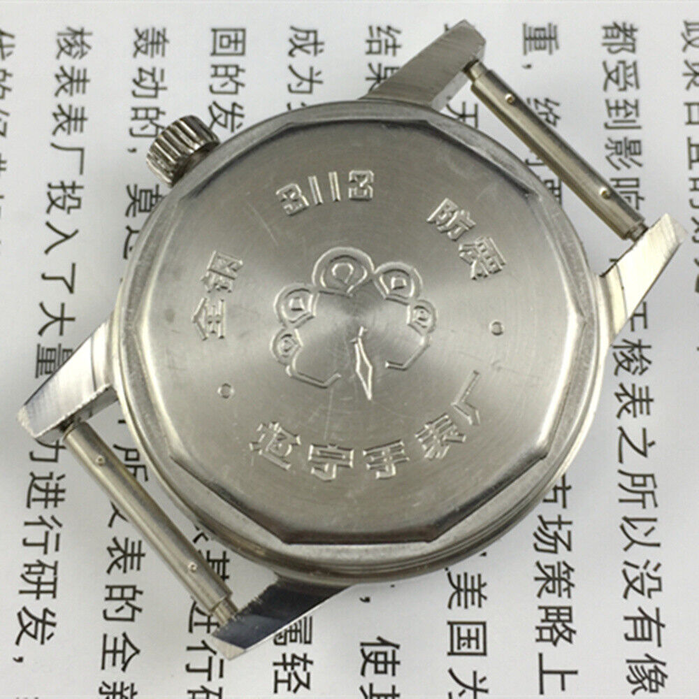 Silver dial 33mm Dandong manual watch with golden hands, 17 jewels, classic style by Dandong.