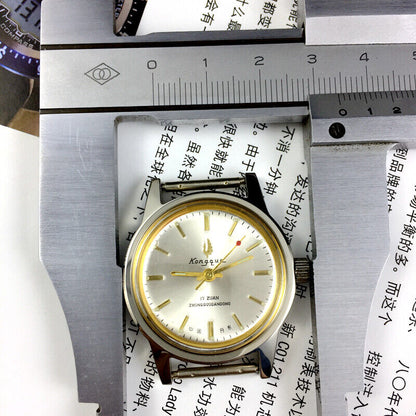 Silver dial 33mm Dandong manual watch with golden hands, 17 jewels, classic design for elegant timekeeping.
