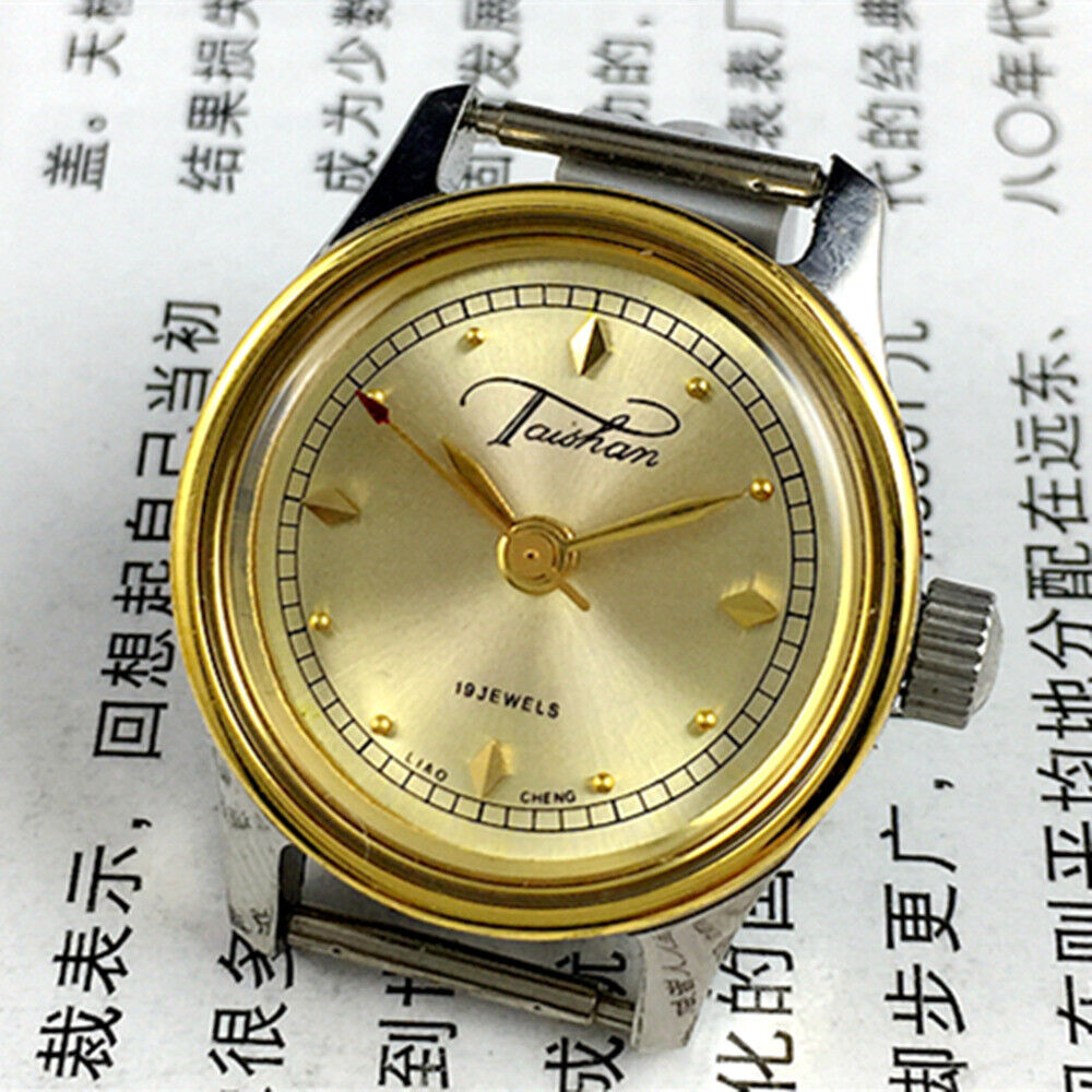 26mm Liaocheng TAISHAN lady watch with gold case, manual mechanical movement and 19 jewels, elegant design.
