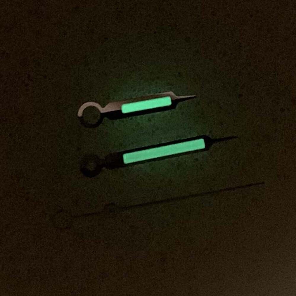 Green luminous watch hands with silver trim for NH35/NH36/4R/7S movements, improving readability and elegance.